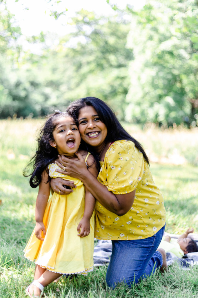 Mom and daughter smiling taken by Mallorie Miller Photography 